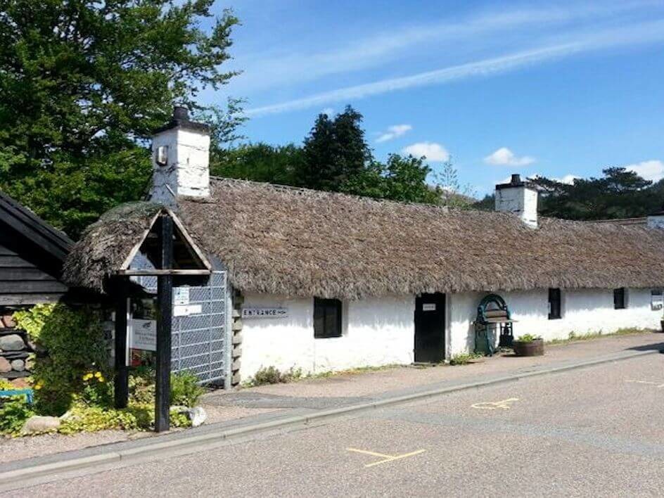 Exterior of Glencoe Folk Museum with heather roof