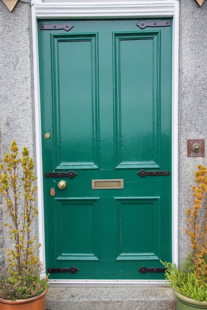 Green front door with new black mock hinges