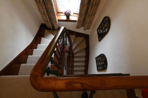 Looking down the staircase at Fern Villa