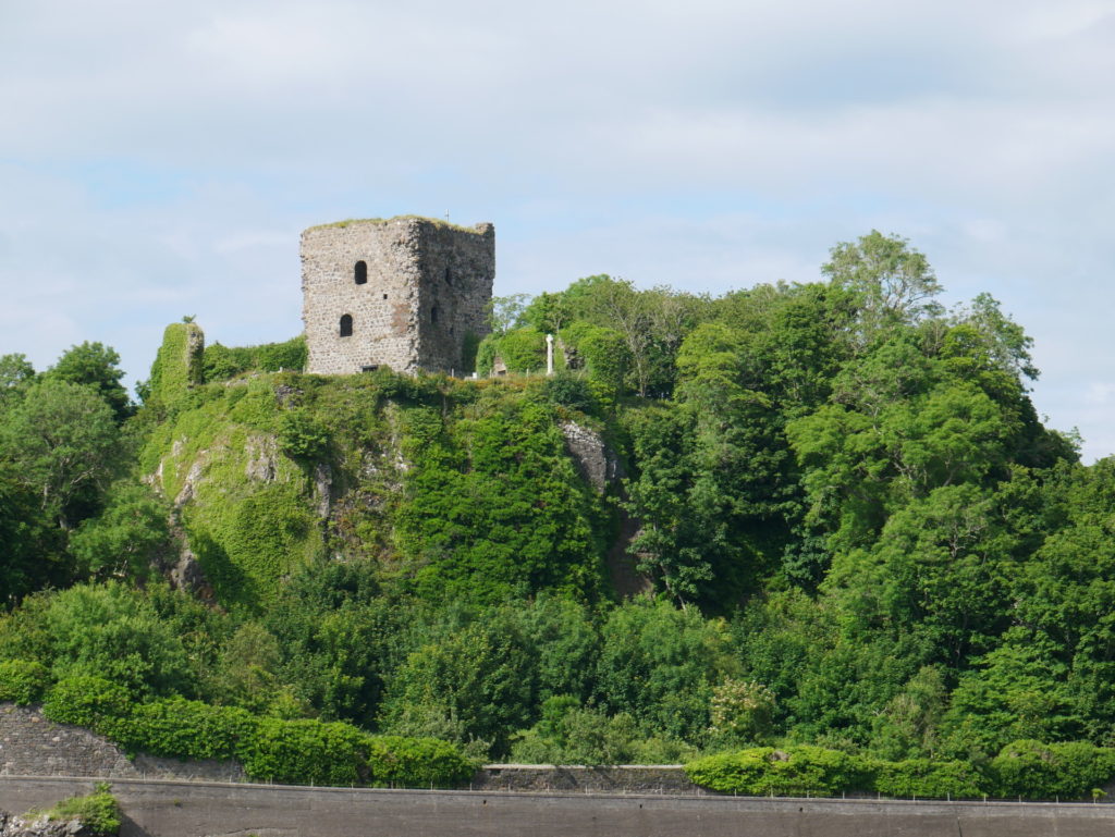 Dunollie Castle Oban on a rocky crag covered in green plants