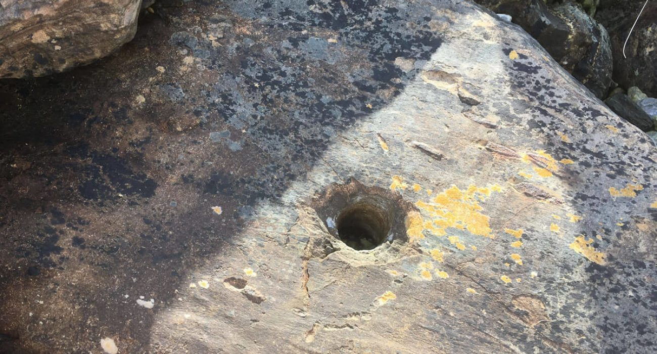 A drilled hole in a rock